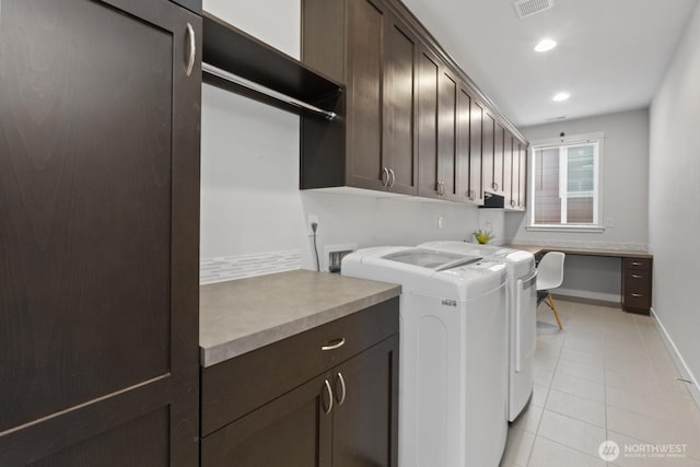 washroom featuring light tile patterned floors, recessed lighting, baseboards, cabinet space, and washing machine and clothes dryer