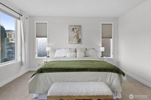 bedroom with carpet flooring and baseboards