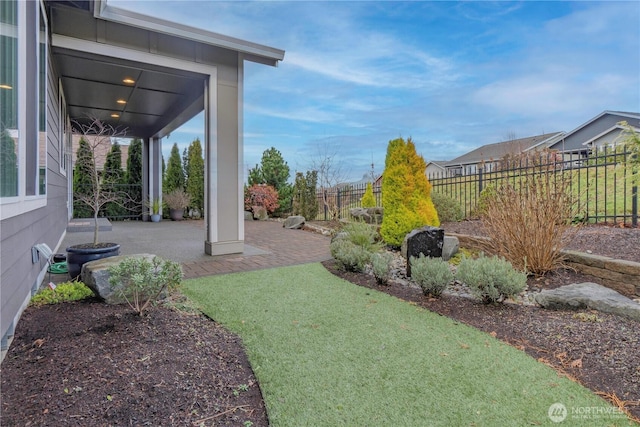 view of yard featuring a patio and fence