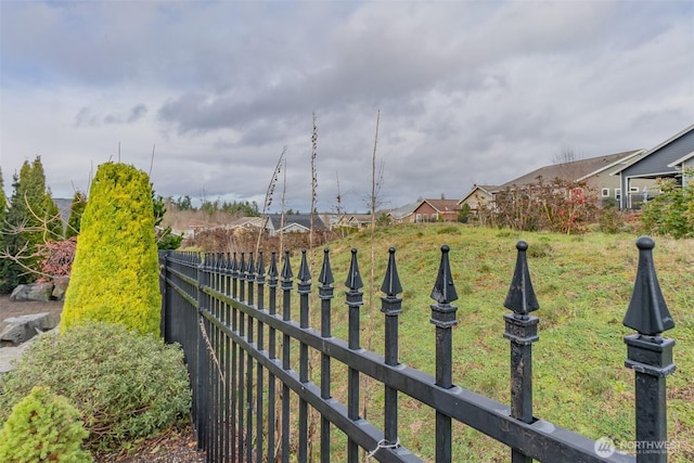 view of yard featuring a residential view and fence