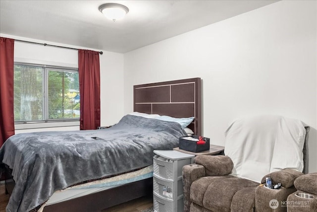 bedroom featuring wood finished floors