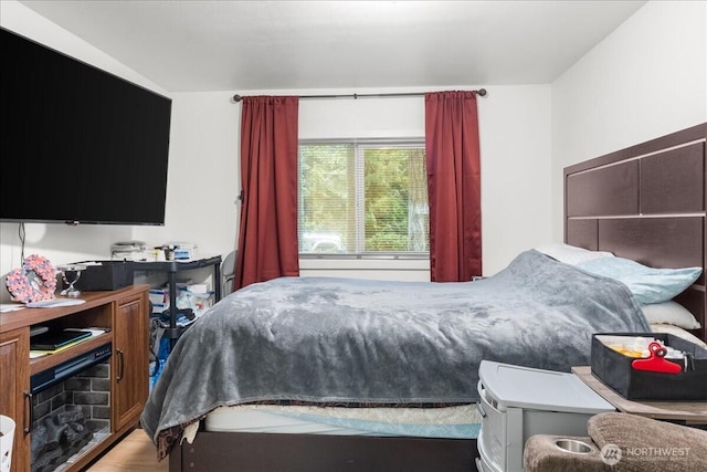 bedroom with wood finished floors