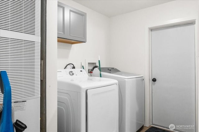 laundry area featuring cabinet space and washer and dryer