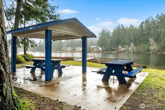 surrounding community featuring a gazebo and a water view