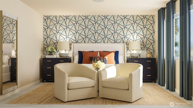 carpeted bedroom featuring an accent wall, baseboards, and wallpapered walls