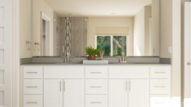 bathroom with double vanity and a sink