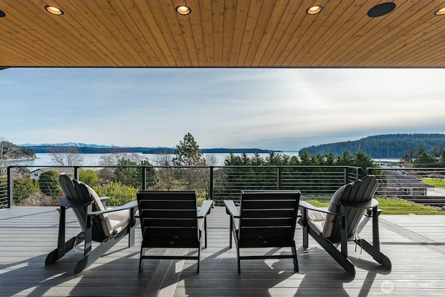 wooden deck featuring a water view