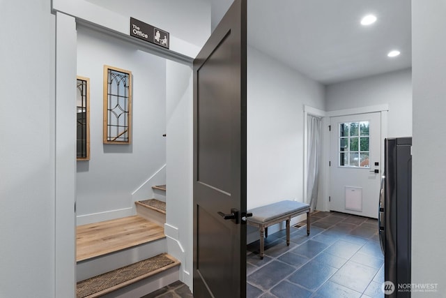 stairs featuring baseboards and recessed lighting