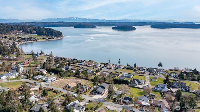 birds eye view of property featuring a residential view and a water and mountain view