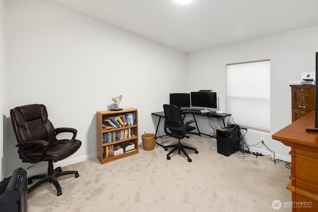 carpeted office space with baseboards