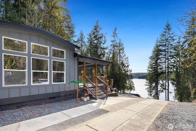 view of property exterior featuring crawl space and board and batten siding