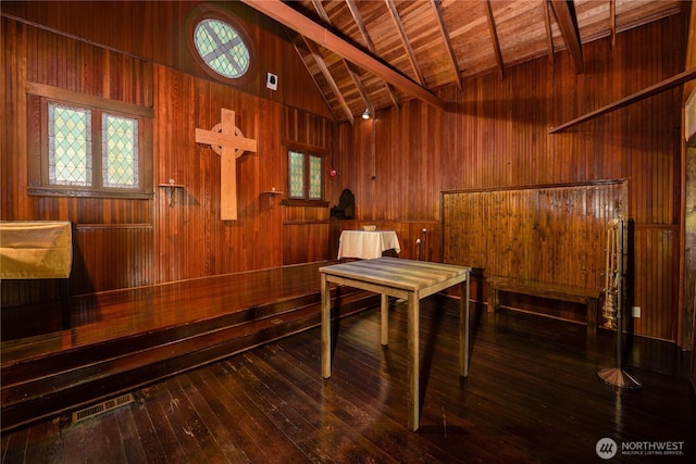 interior space featuring a sauna, wood-type flooring, wood ceiling, and wooden walls