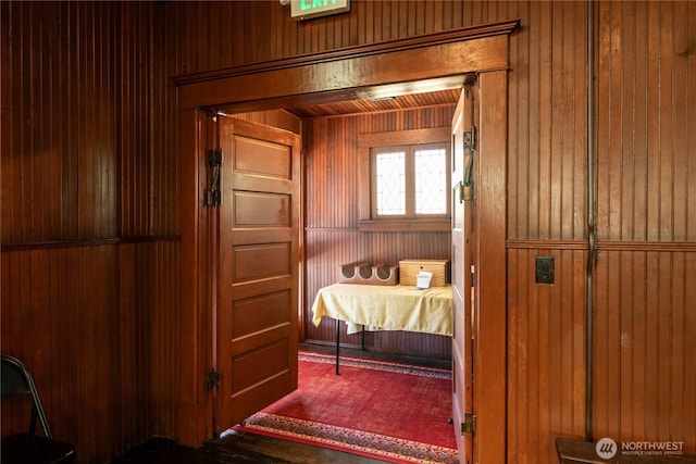 interior space featuring wood walls