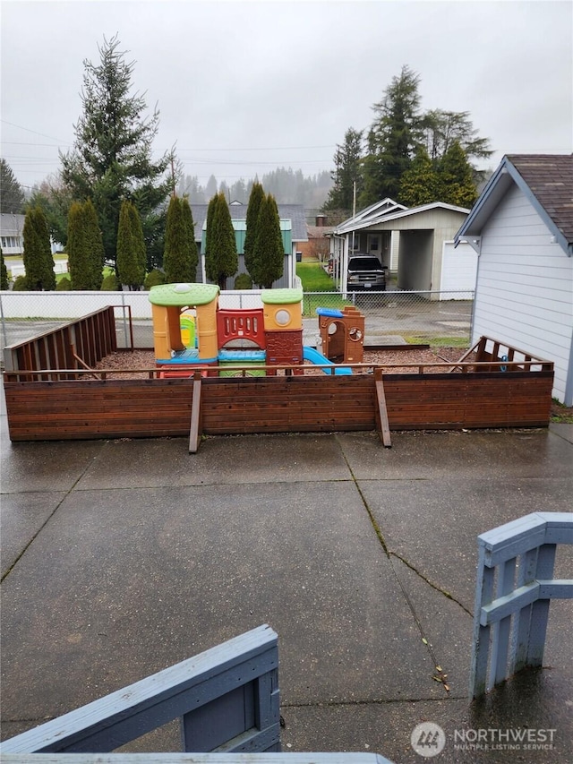 view of patio featuring fence