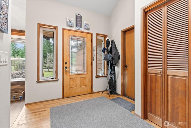 foyer featuring wood finished floors