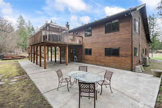 back of house with outdoor dining area, central AC, a deck, and a patio area