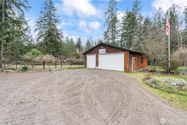 detached garage with fence