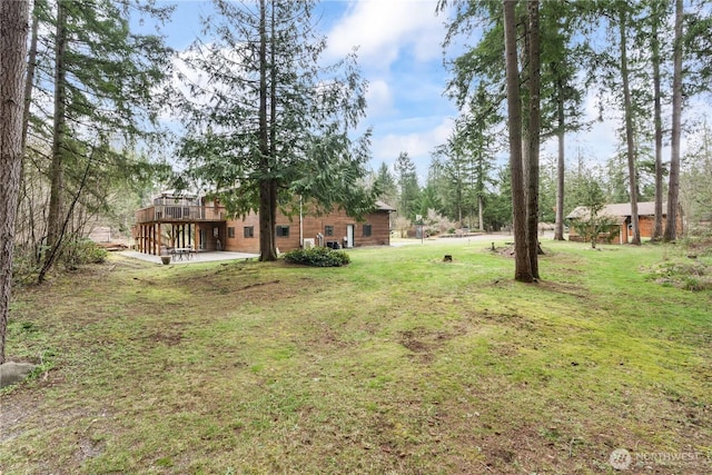 view of yard with a wooden deck