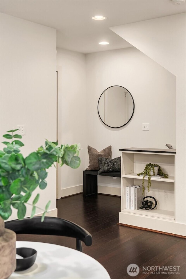 details featuring baseboards, wood finished floors, and recessed lighting