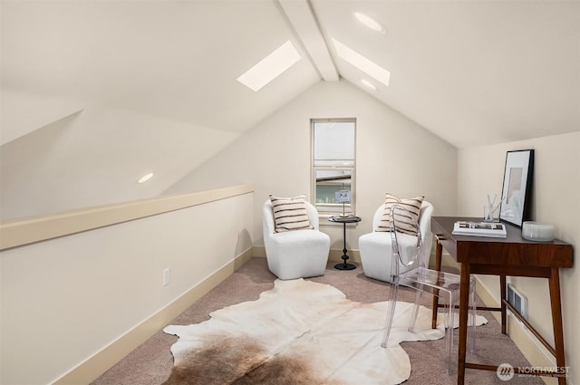 sitting room featuring light carpet, lofted ceiling with skylight, visible vents, and baseboards