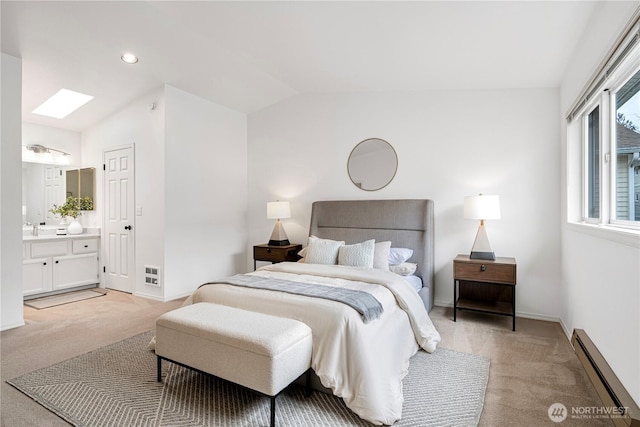 bedroom with light carpet, baseboards, lofted ceiling, a baseboard heating unit, and a sink