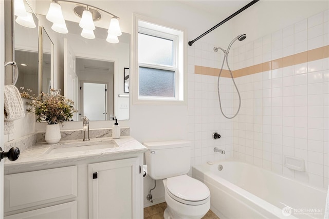 full bathroom with  shower combination, vanity, and toilet