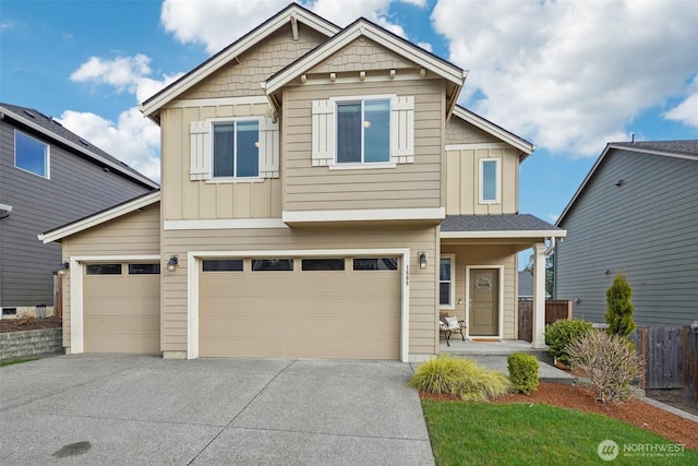 craftsman-style house featuring a garage, board and batten siding, and concrete driveway