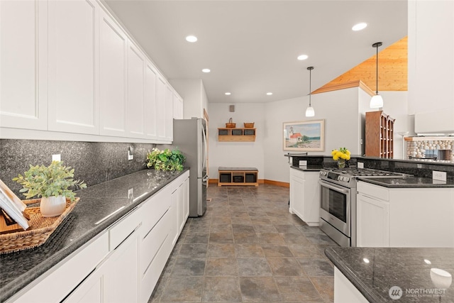 kitchen with white cabinets, decorative backsplash, hanging light fixtures, stainless steel appliances, and recessed lighting