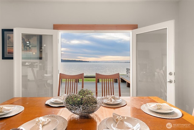 dining space with a water view