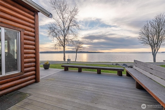 wooden deck featuring a water view