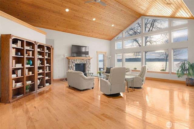 living room with high vaulted ceiling, a fireplace, wood finished floors, wood ceiling, and baseboards