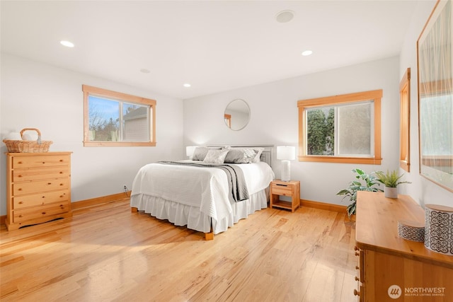 bedroom featuring recessed lighting, light wood-type flooring, and baseboards