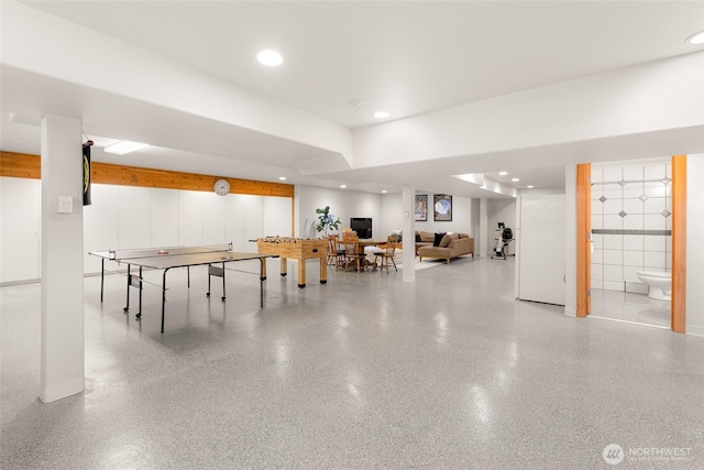 game room featuring recessed lighting and speckled floor