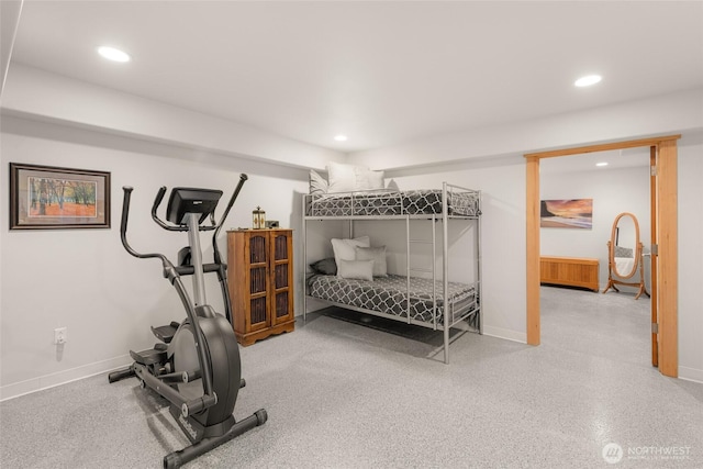 exercise room featuring baseboards and recessed lighting