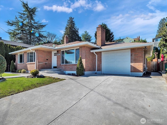 single story home with a garage, driveway, brick siding, and a chimney