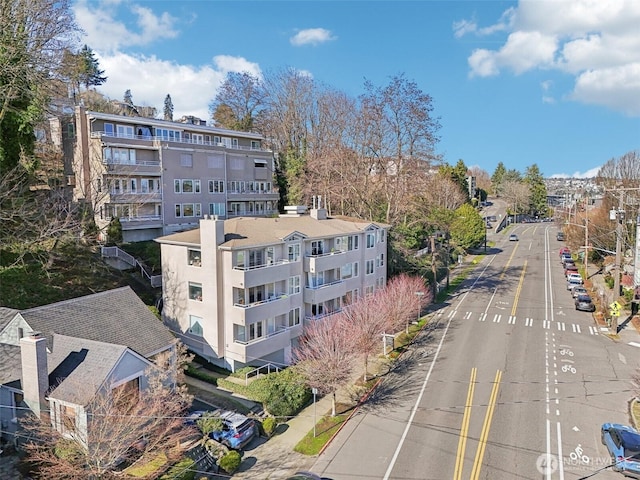 birds eye view of property with a residential view