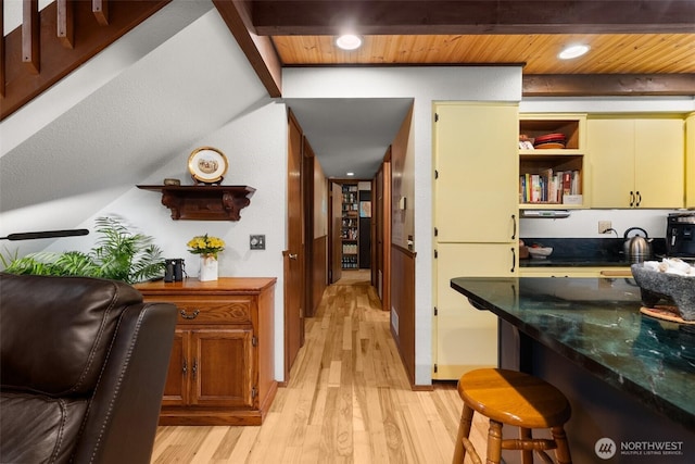 hall with recessed lighting, beam ceiling, wooden ceiling, and light wood finished floors