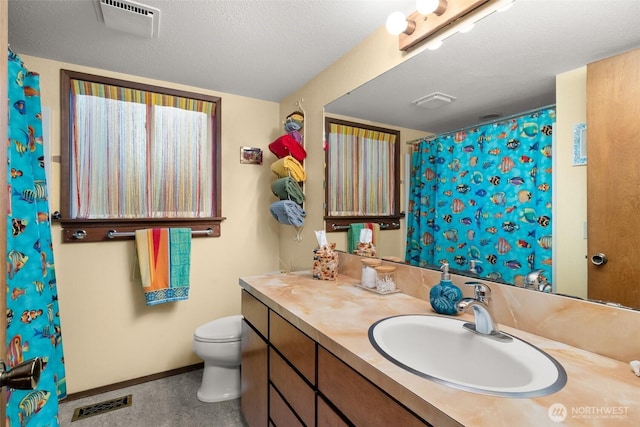 full bath featuring visible vents, toilet, vanity, and baseboards