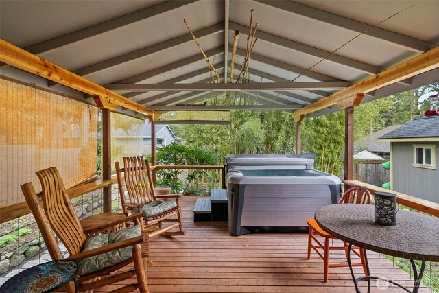 wooden terrace featuring a hot tub