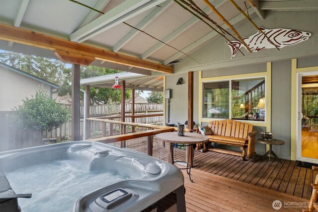 wooden terrace featuring fence and a hot tub