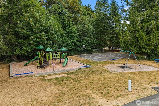 communal playground featuring community basketball court and a yard