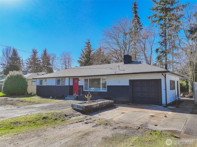 single story home with a garage and concrete driveway