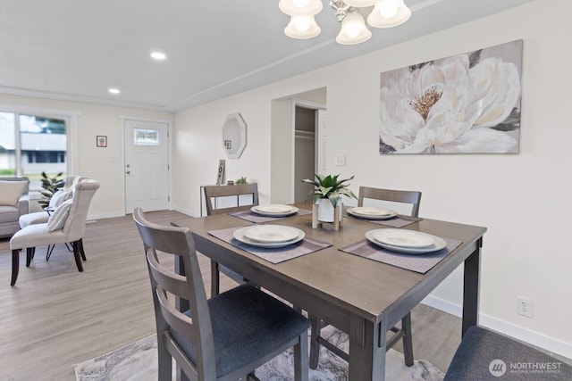 dining space featuring a chandelier, recessed lighting, light wood-type flooring, and baseboards