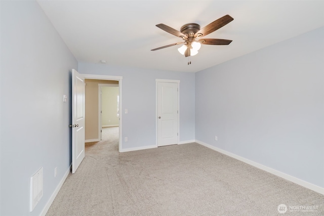 unfurnished bedroom with light colored carpet, baseboards, visible vents, and ceiling fan