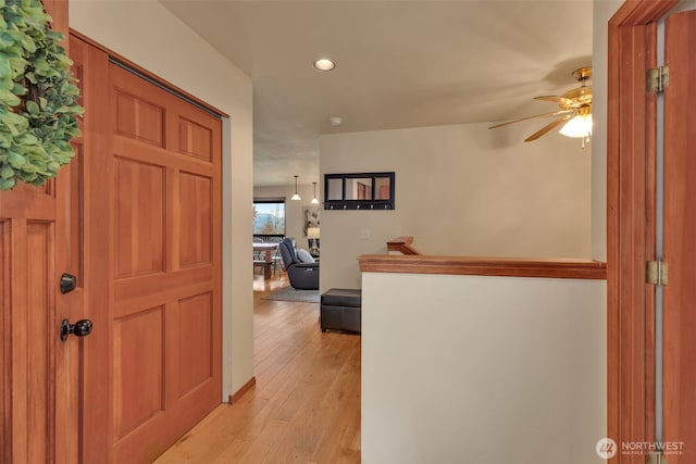 interior space with light wood-style flooring and recessed lighting