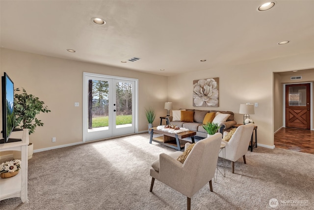 living room featuring recessed lighting, visible vents, baseboards, french doors, and carpet