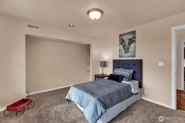 bedroom featuring carpet flooring, visible vents, and baseboards