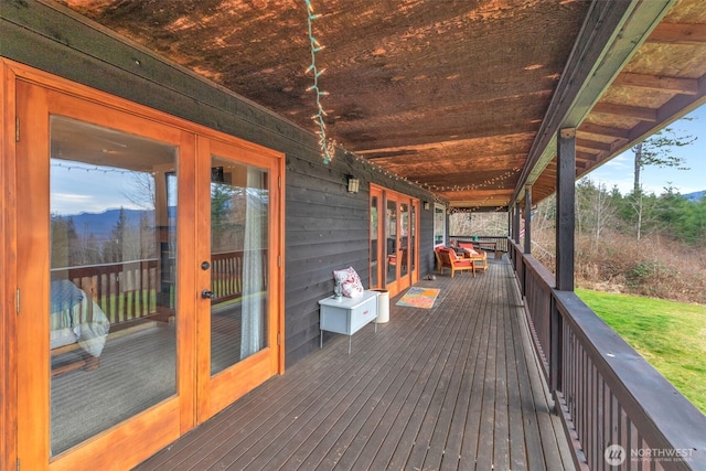 wooden terrace featuring french doors