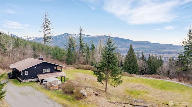 mountain view with a wooded view