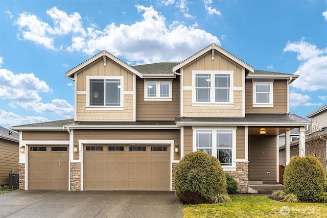 view of front of property featuring board and batten siding, cooling unit, stone siding, and concrete driveway